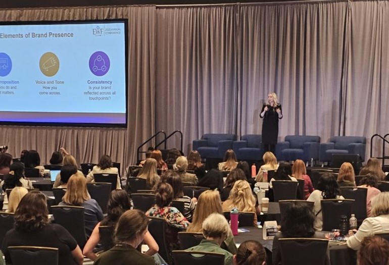 Heather Rim presenting to a leadership audience at a conference